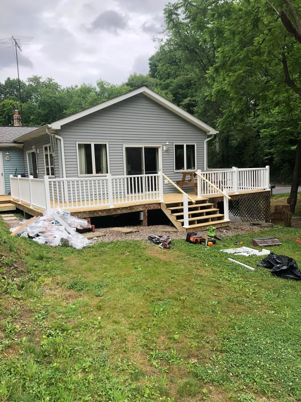 New back deck with white vinyl railing