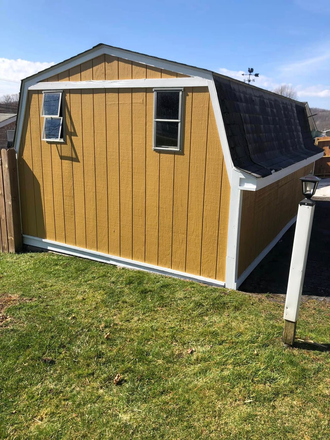 Small barn repaired and painted yellow