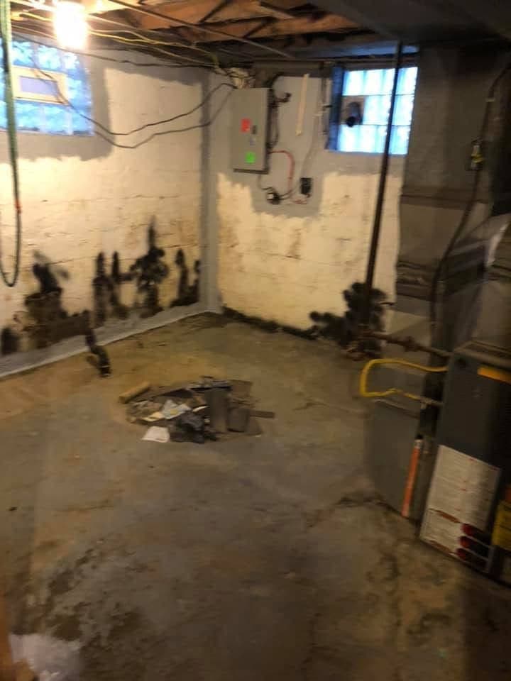 Before: Basement floor and walls painted