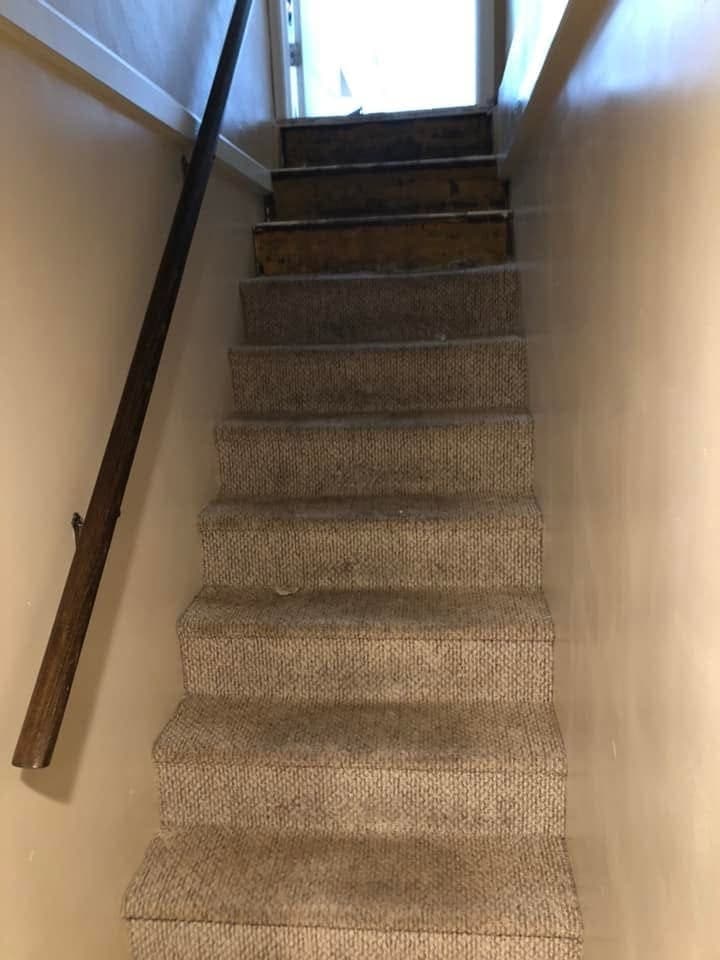 Before: Basement steps refinished in black and white, view 2