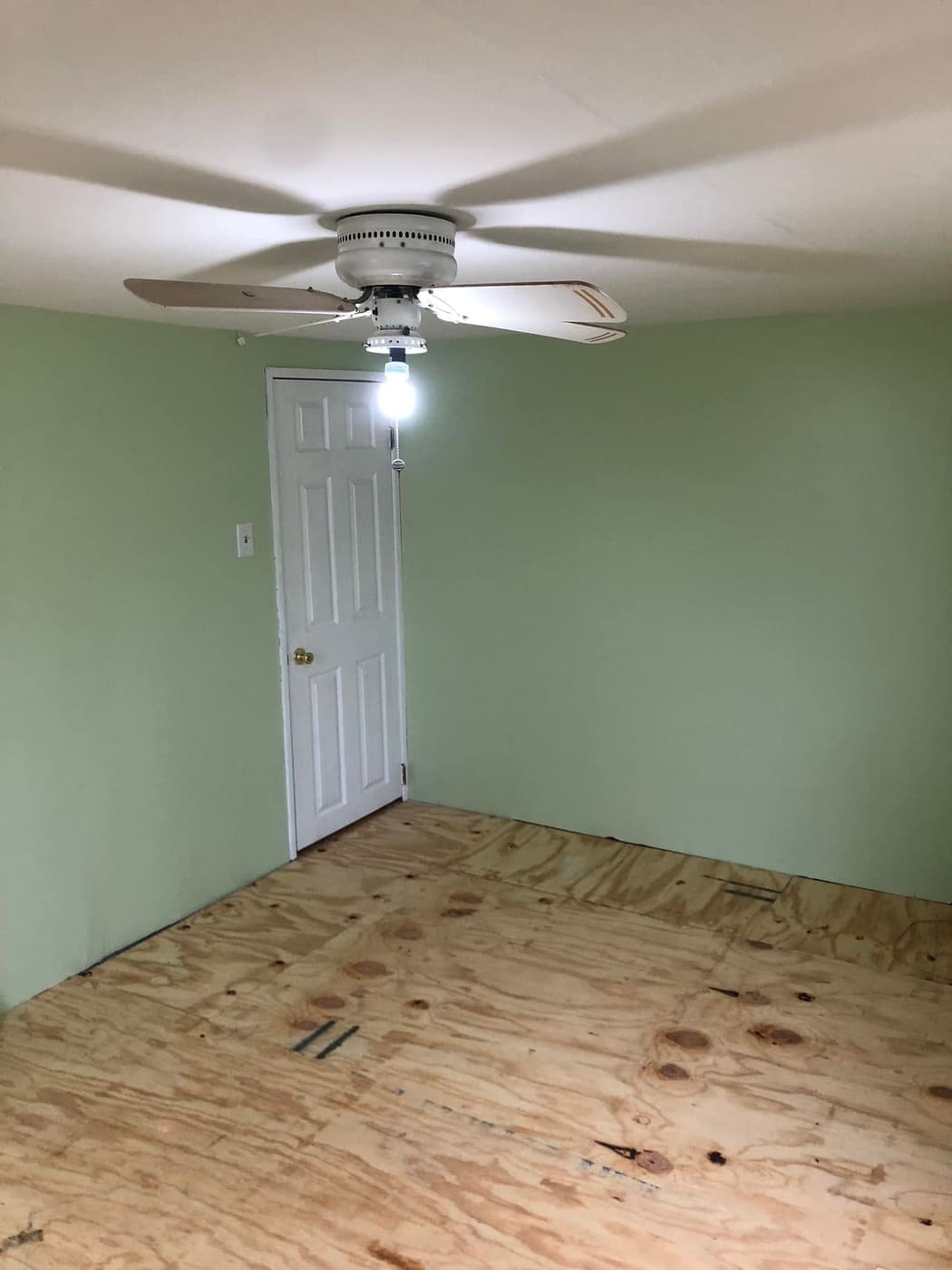 Remodeled bedroom with fresh green paint