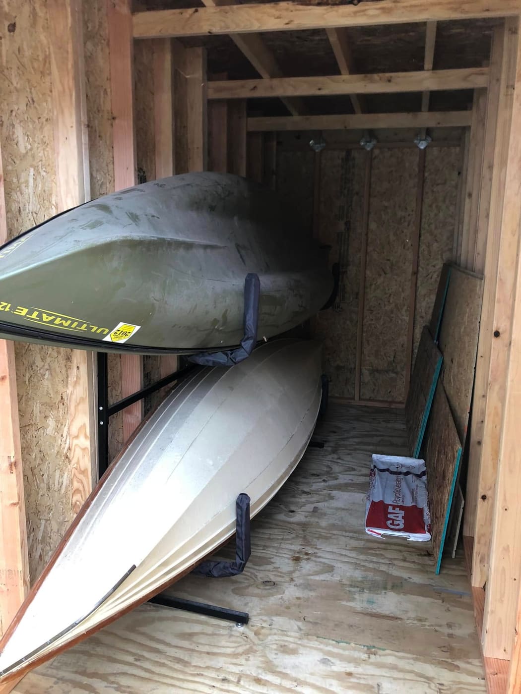 Narrow wood shed built to store canoes