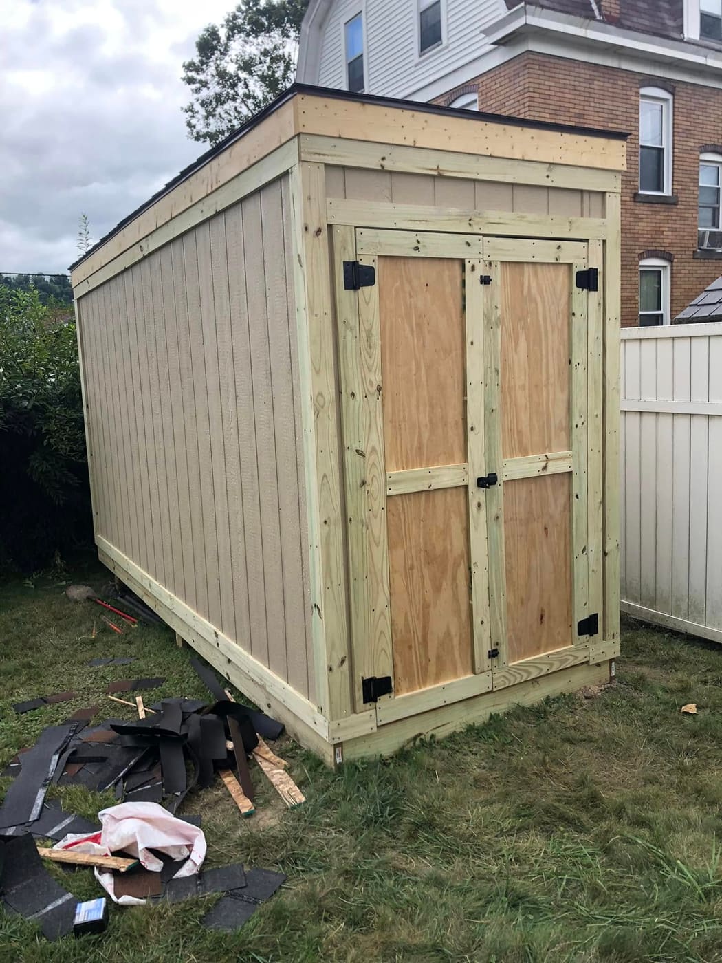 Narrow wood shed built to store canoes, view 3
