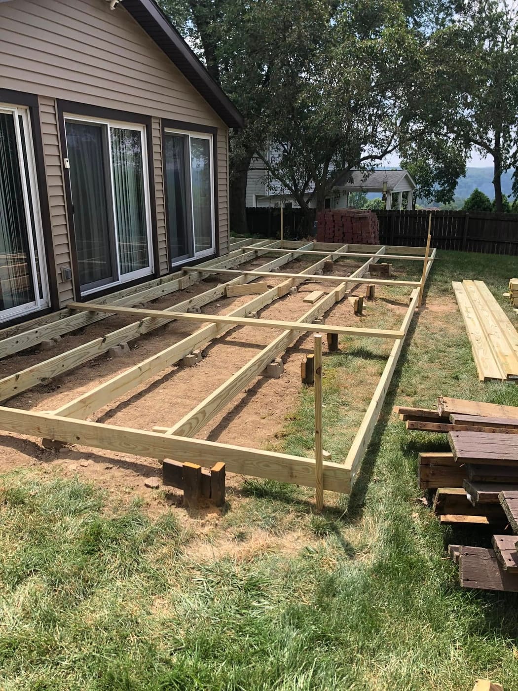 Stained deck with black metal balusters