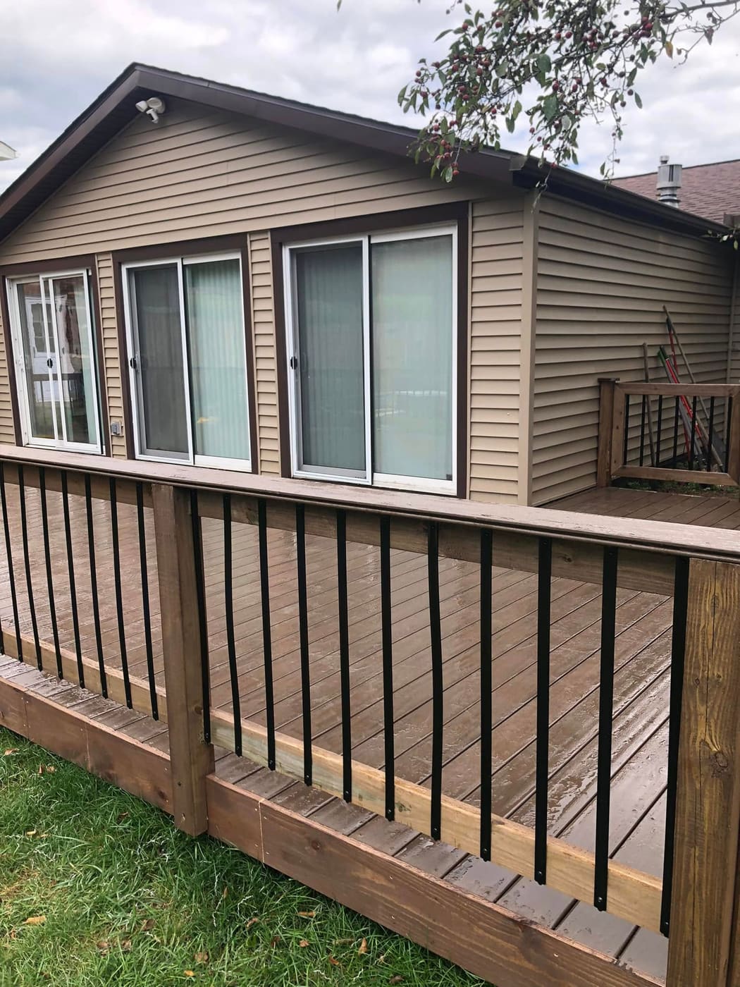Stained deck with black metal balusters, view 3