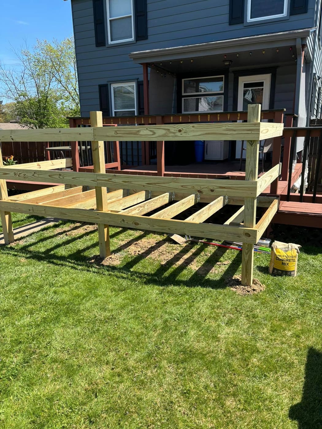 Deck extension with railing and lattice skirting