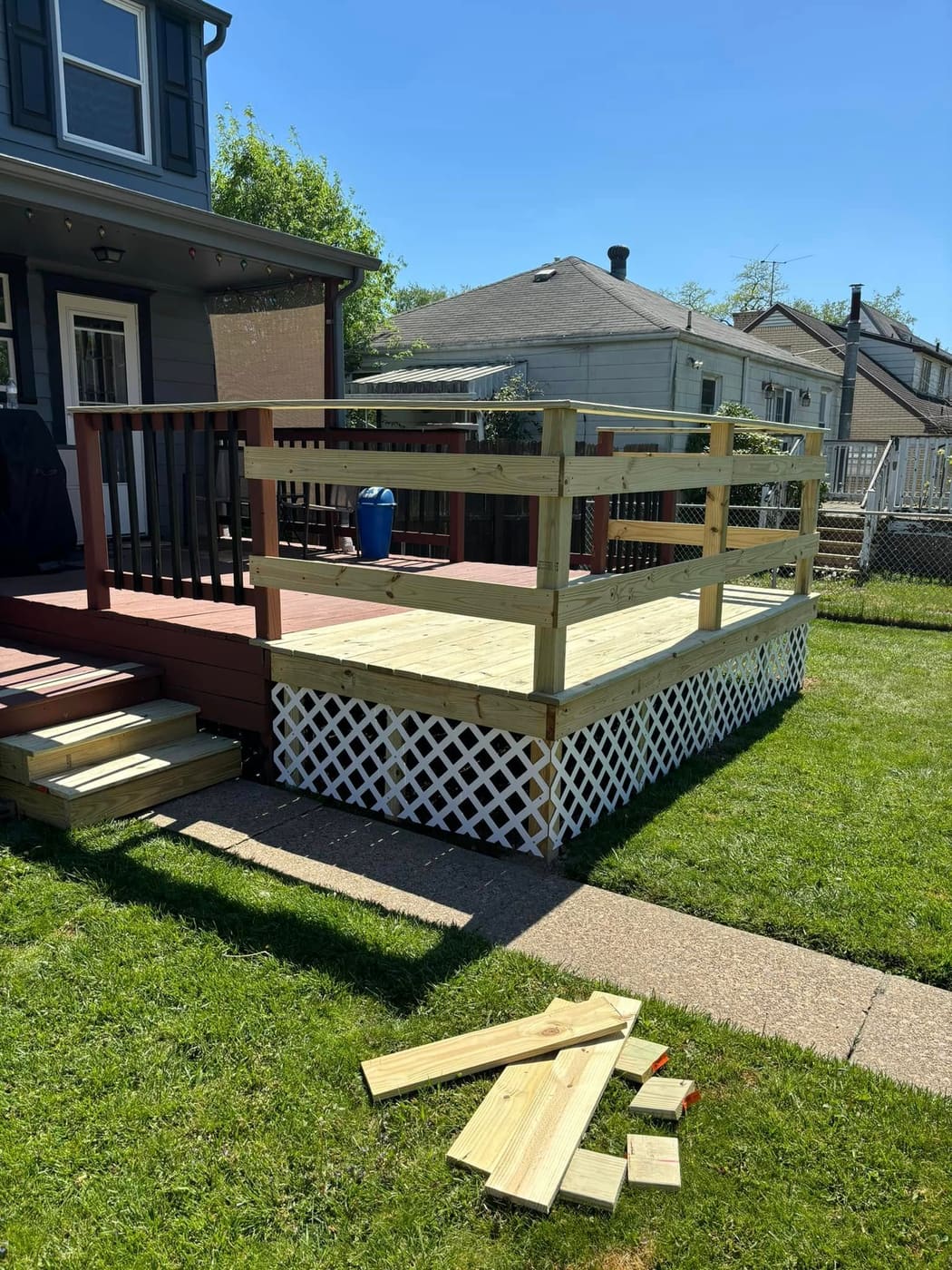 Deck extension with railing and lattice skirting, view 5