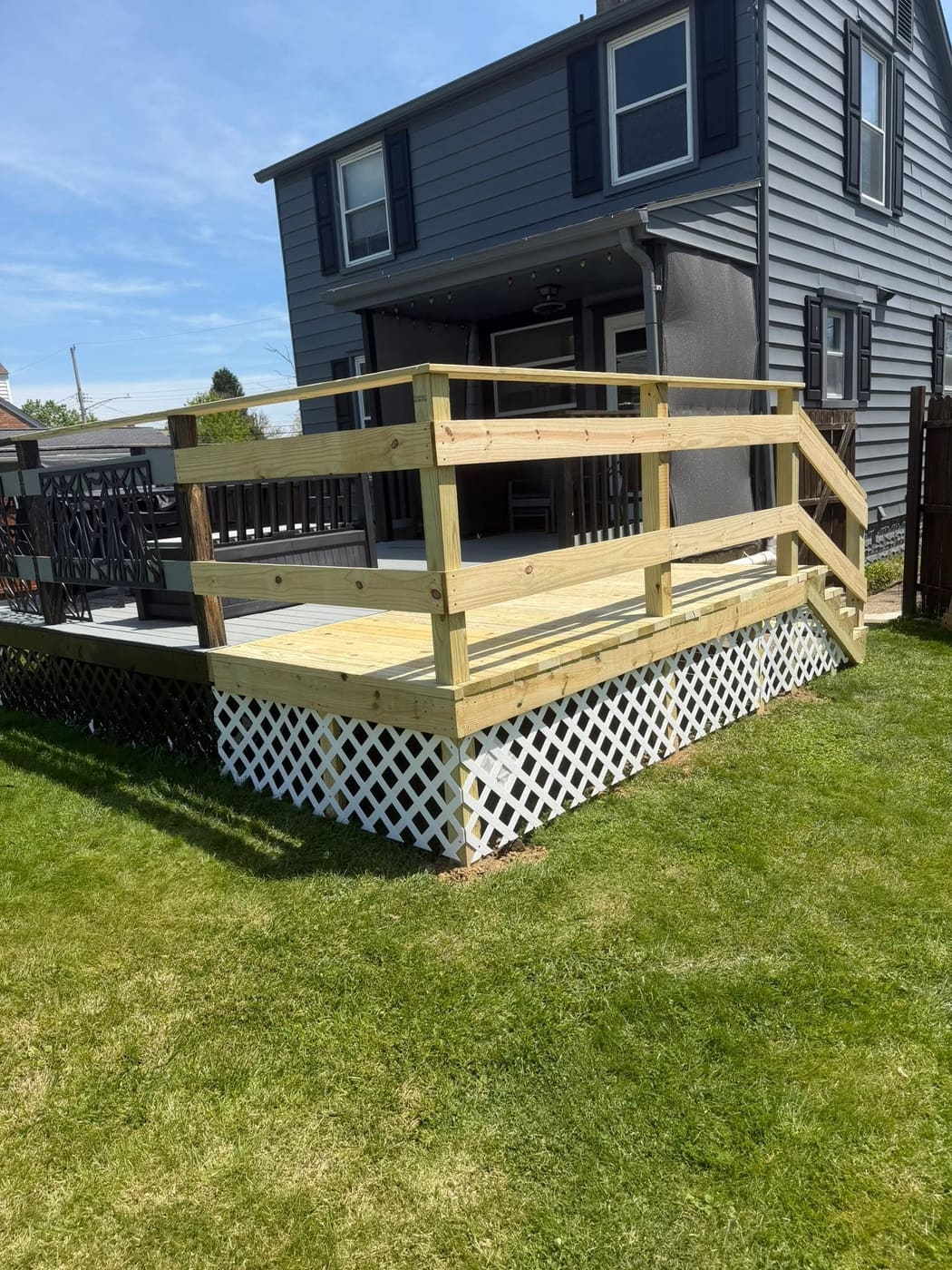 Deck extension with white lattice skirting