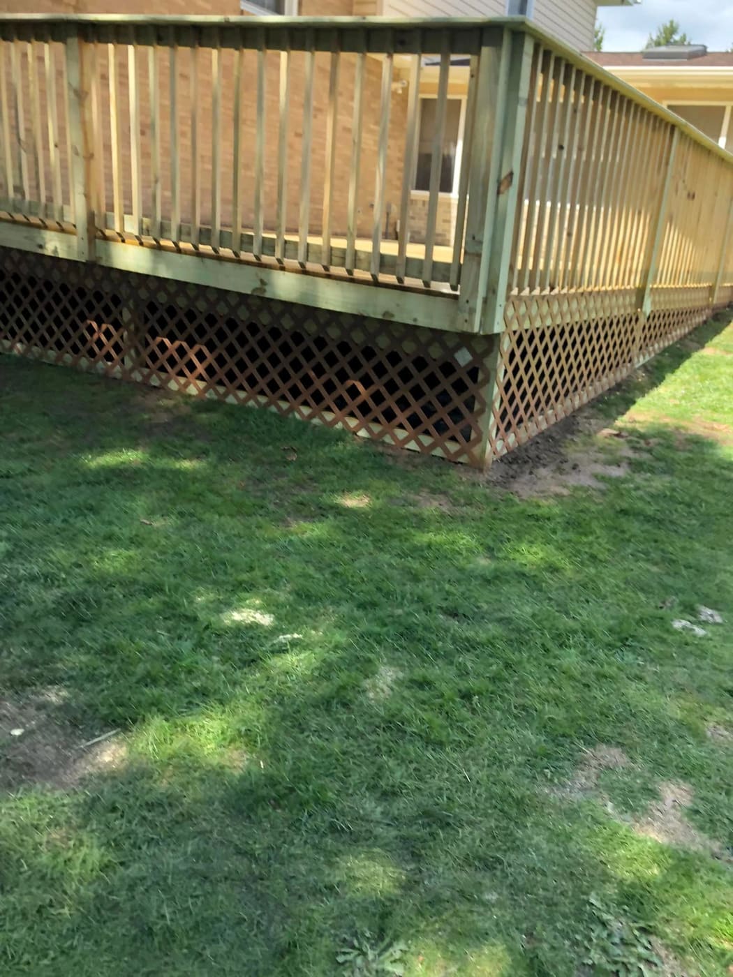 New deck with railing and lattice skirting