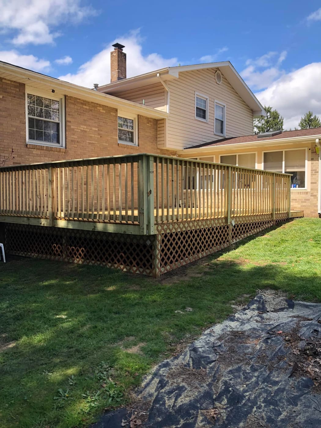 New deck with railing and lattice skirting, view 3