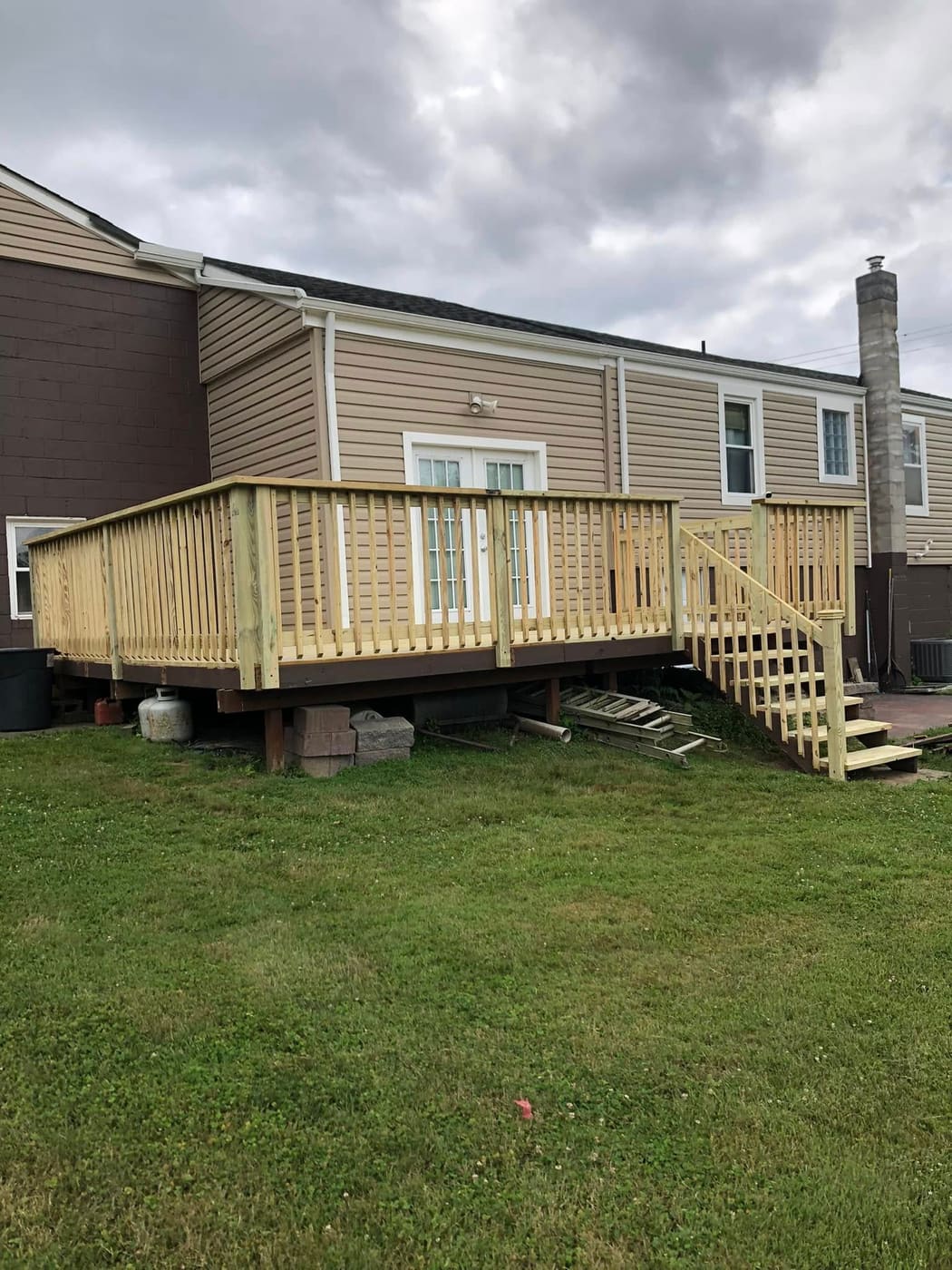 New deck built over a block retaining wall