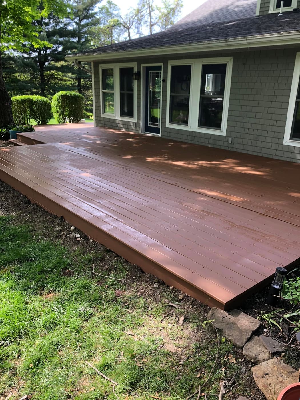 Ground-level deck painted gray