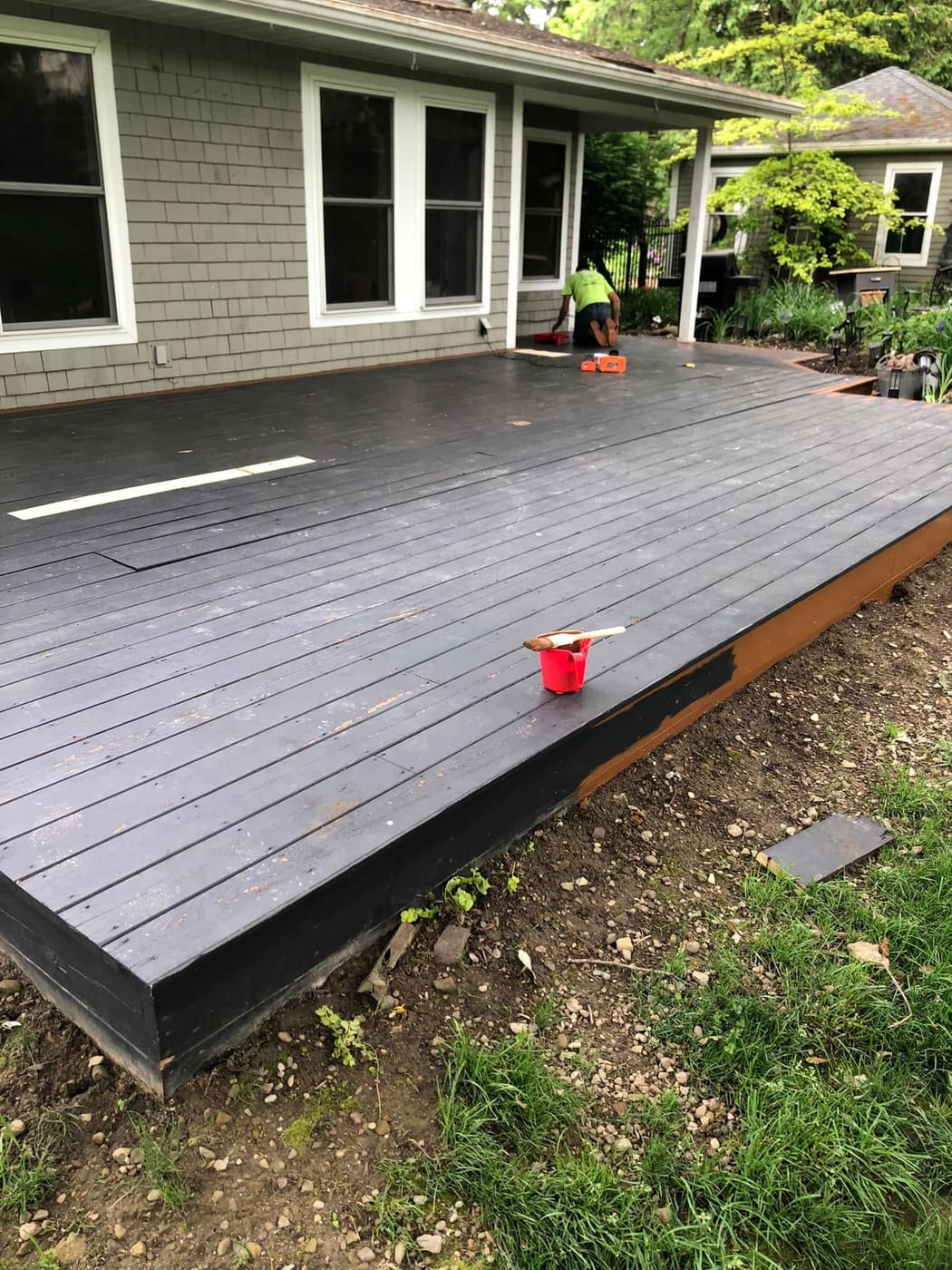 Ground-level deck painted gray, view 4