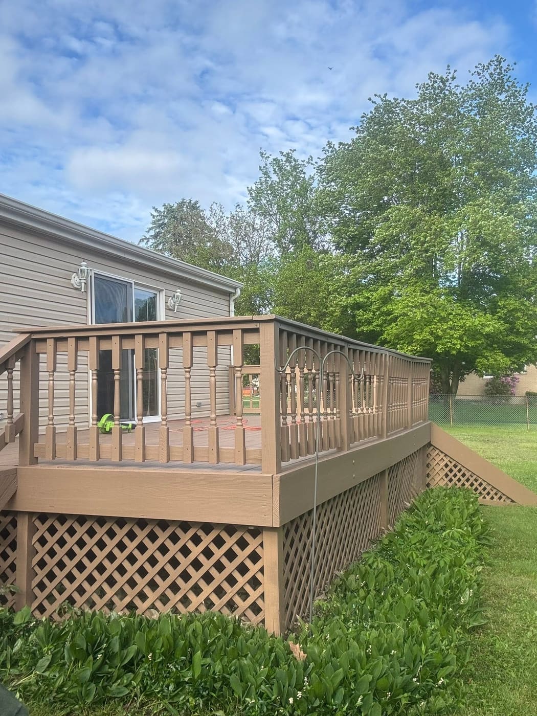 Raised deck with stairs and lattice skirting, view 2