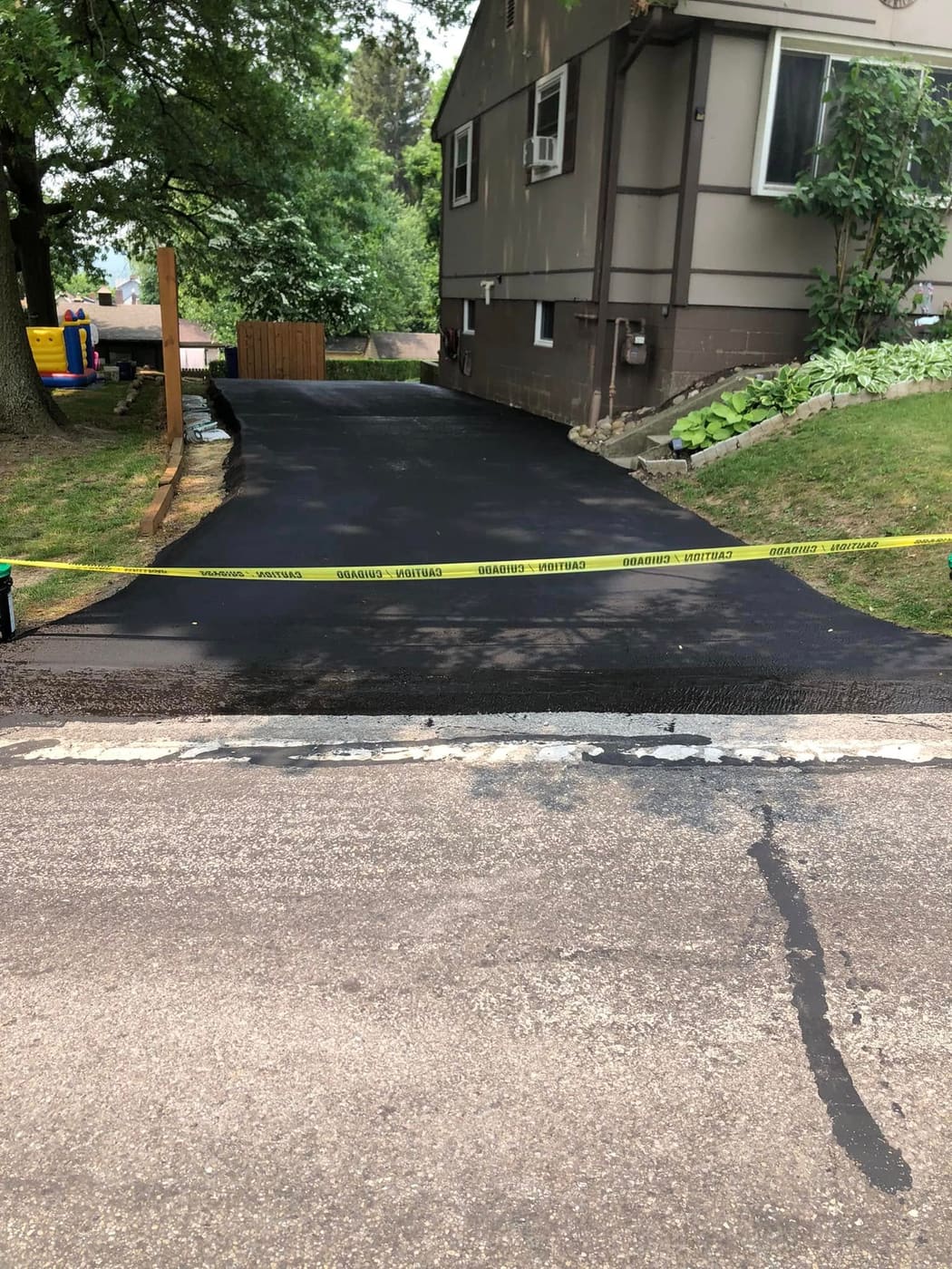 Freshly sealed asphalt driveway