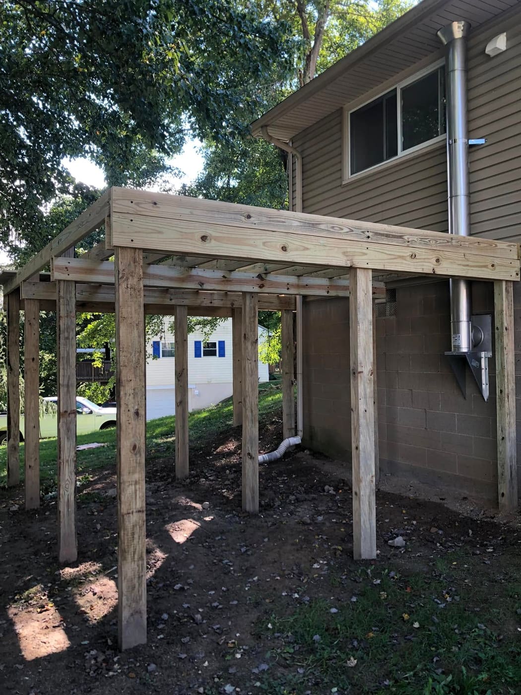 Elevated pressure-treated deck on posts