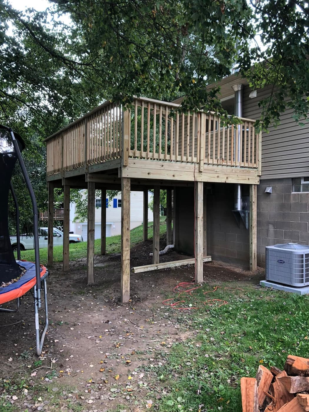 Elevated pressure-treated deck on posts, view 6