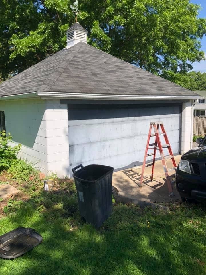 Garage painted white with dark doors