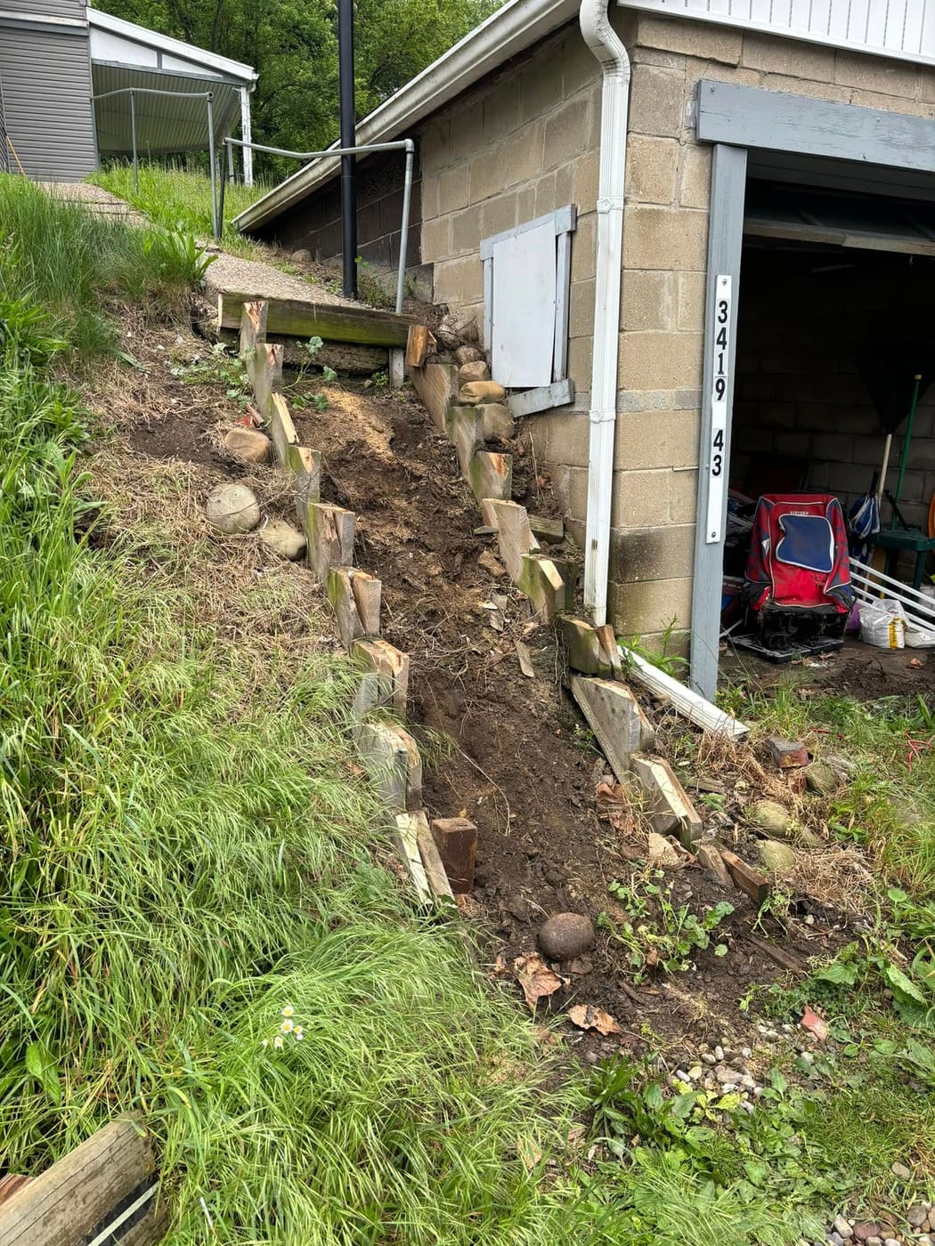 Before: New wood stairs and railing up a hillside