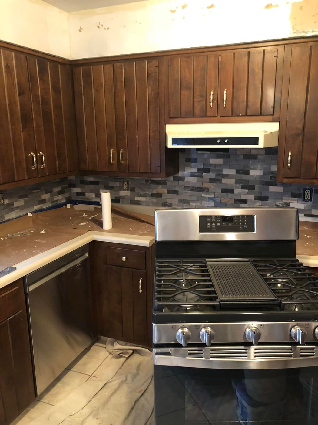 Kitchen with new tile backsplash and counters