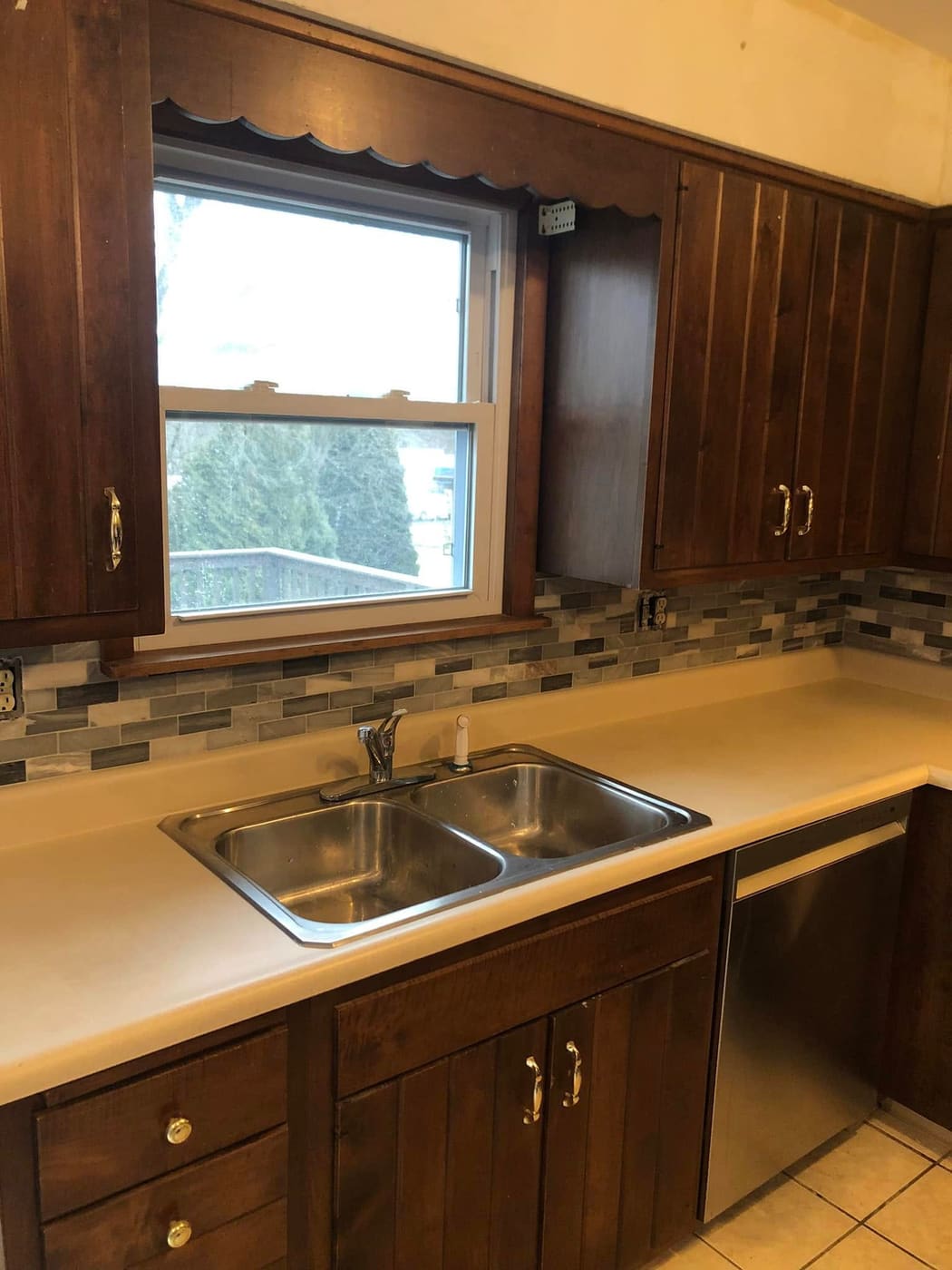 Kitchen with new tile backsplash and counters, view 4