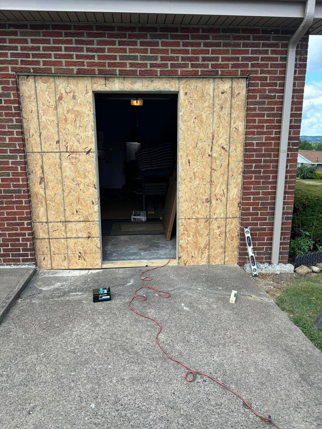 Before: New exterior door framed into a block wall, view 4