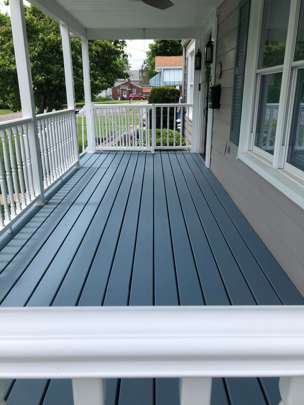 Painted porch floor with white railing