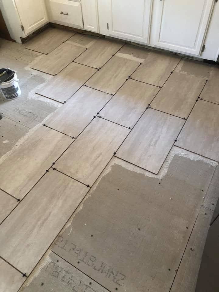 Wood-look plank floor in a hallway, view 4
