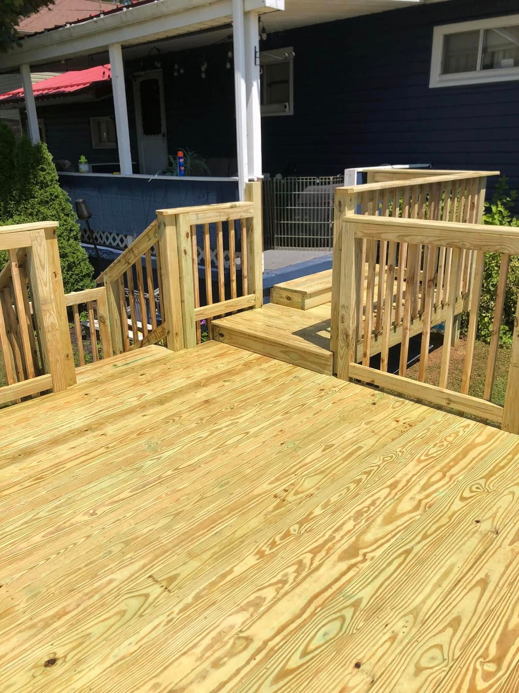 Pressure-treated deck around an above-ground pool