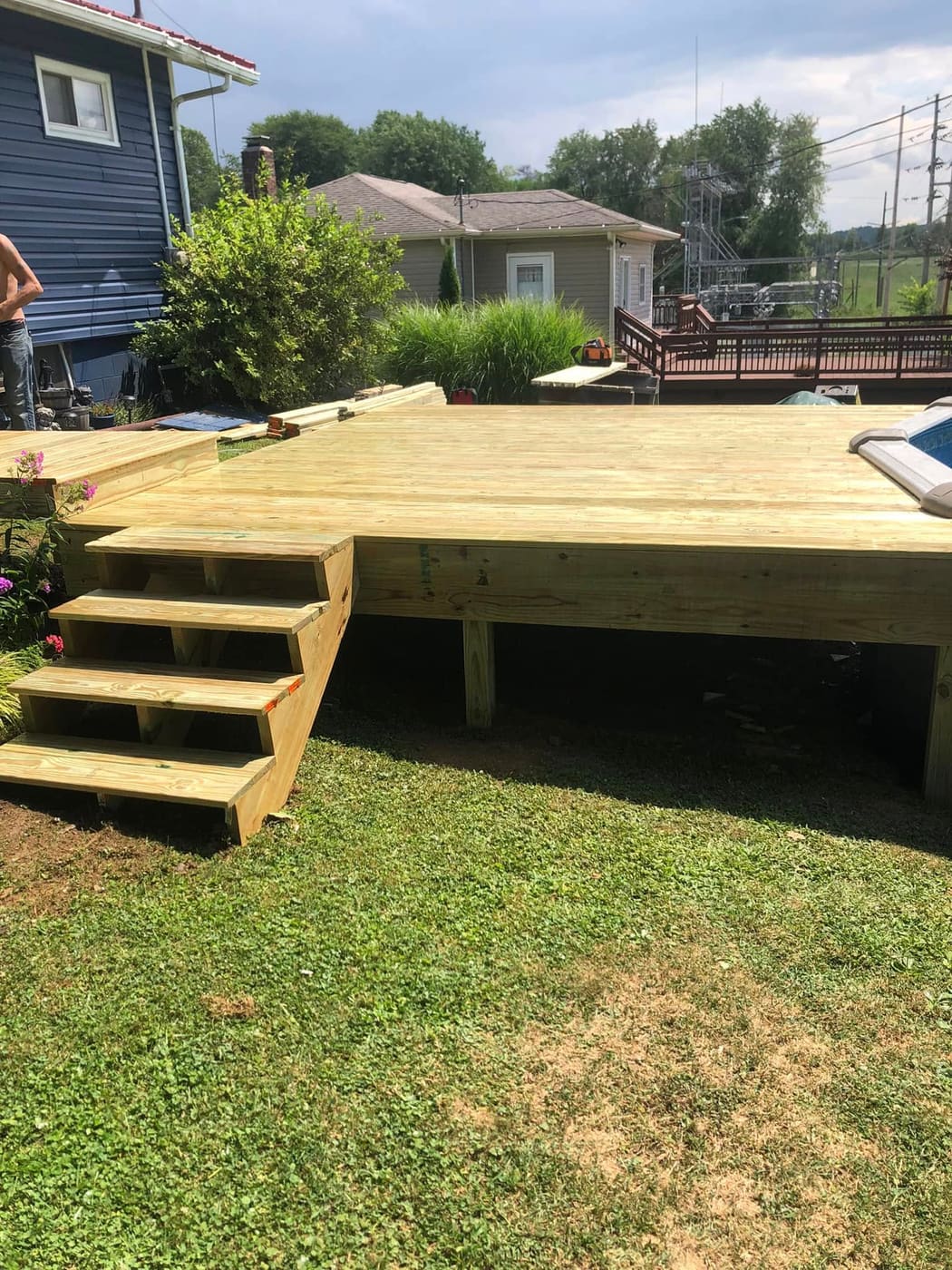 Pressure-treated deck around an above-ground pool, view 4