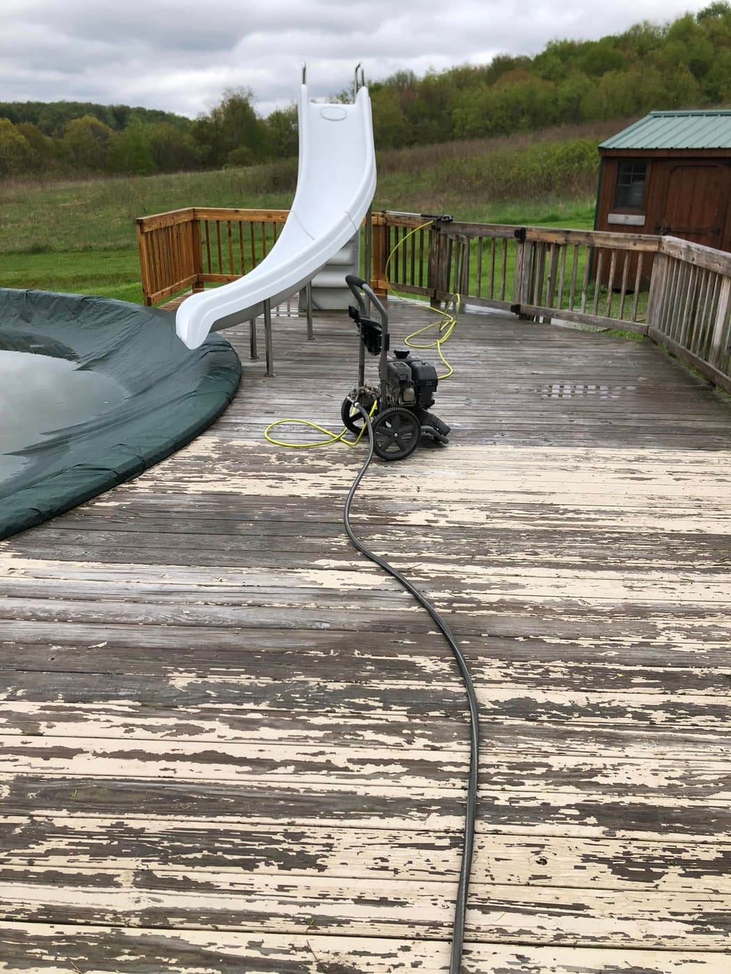 Before: Pool deck pressure washed and stained