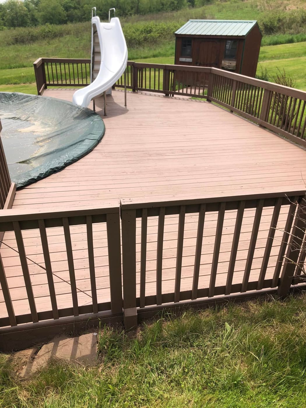 Pool deck pressure washed and stained, view 7