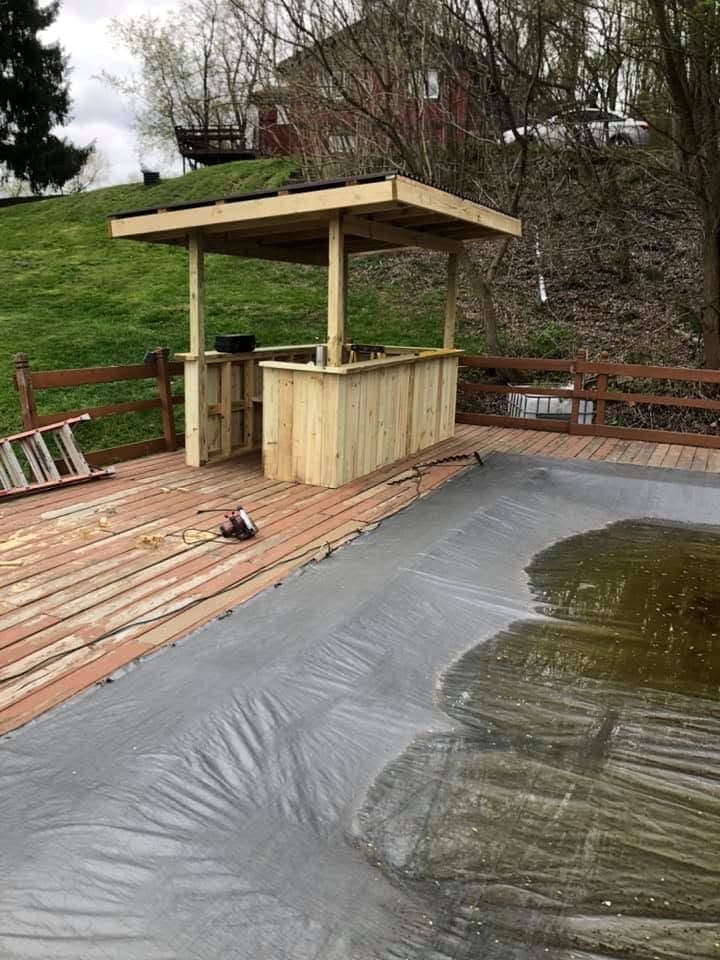 Covered tiki bar on a pool deck