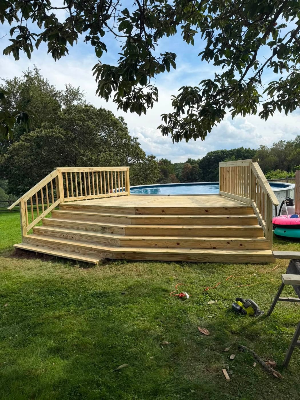Pool deck with wide wraparound steps