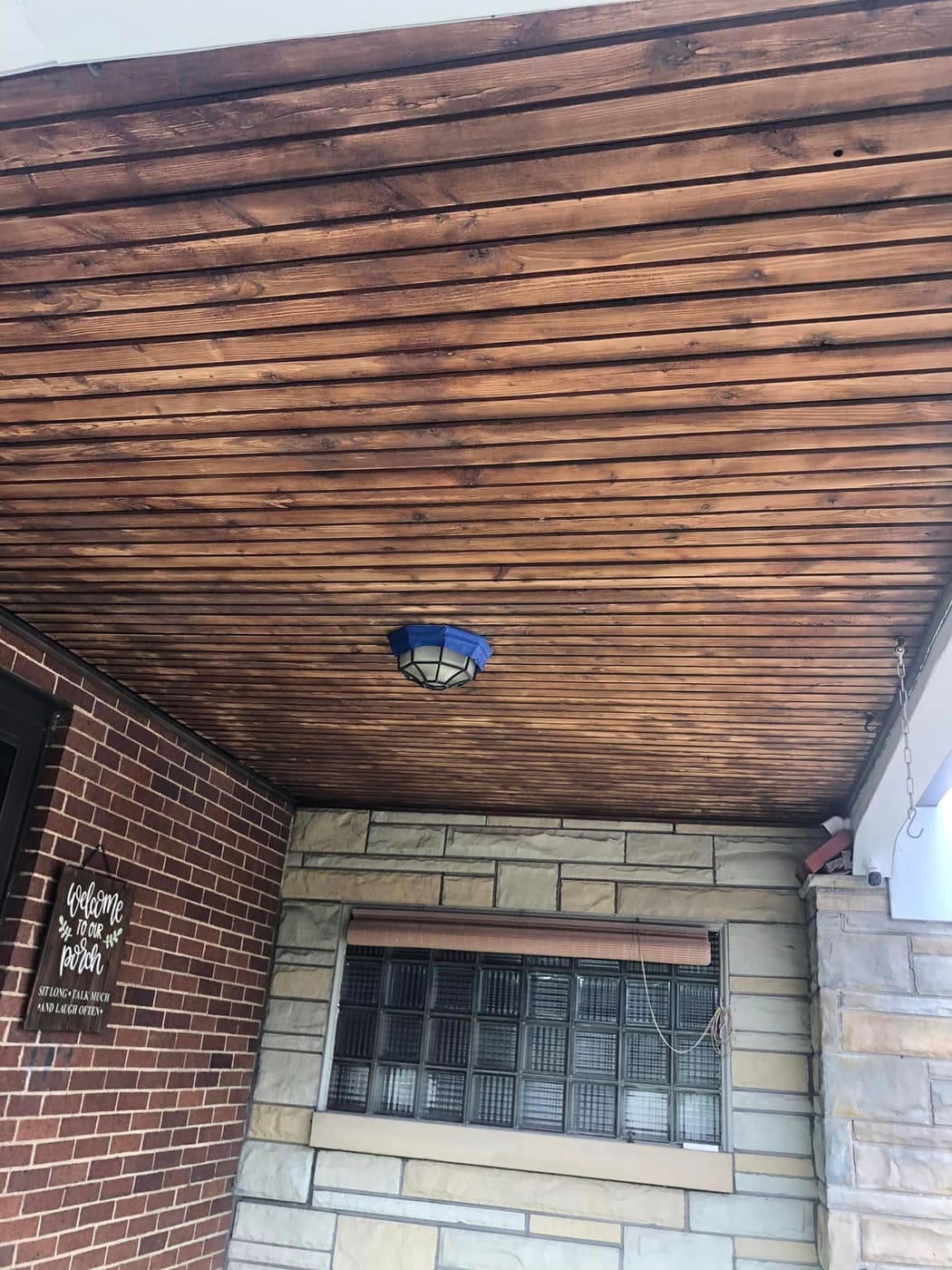 Finished porch ceiling with light fixture
