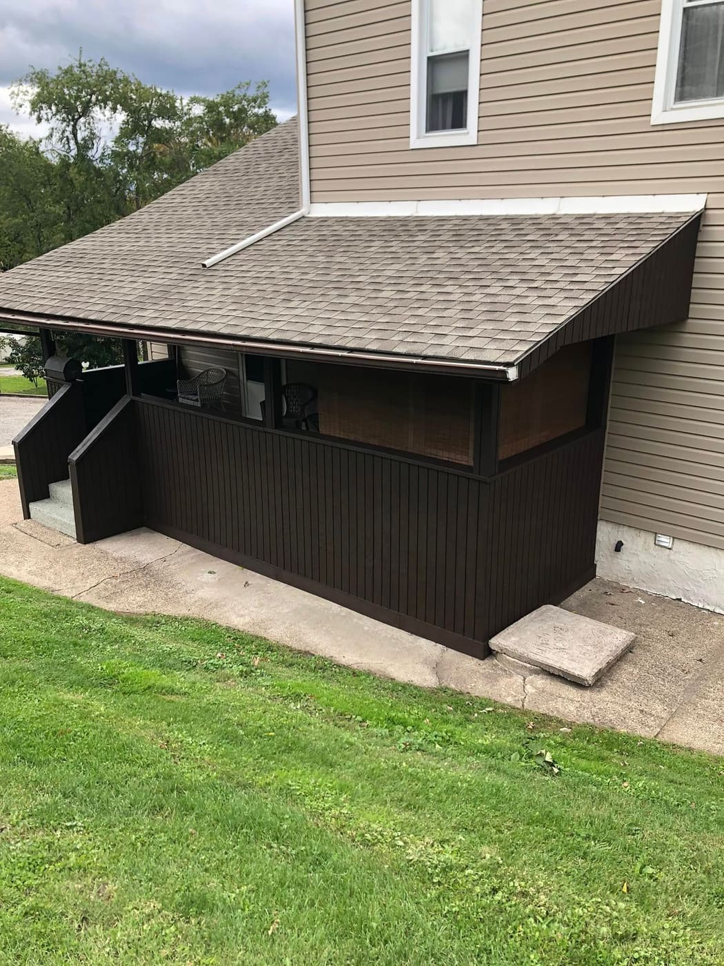 Porch enclosure stained dark brown