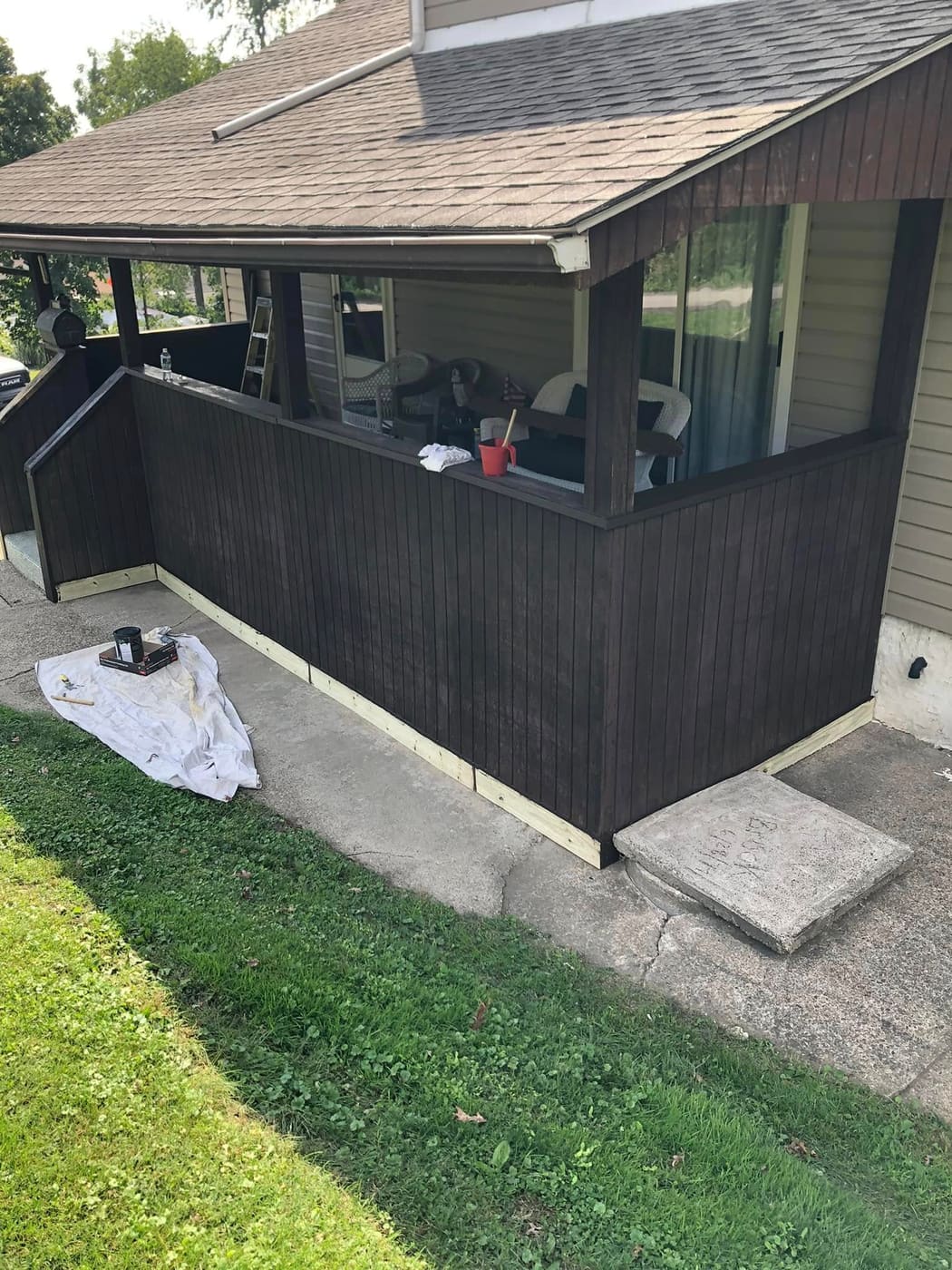 Porch enclosure stained dark brown, view 3