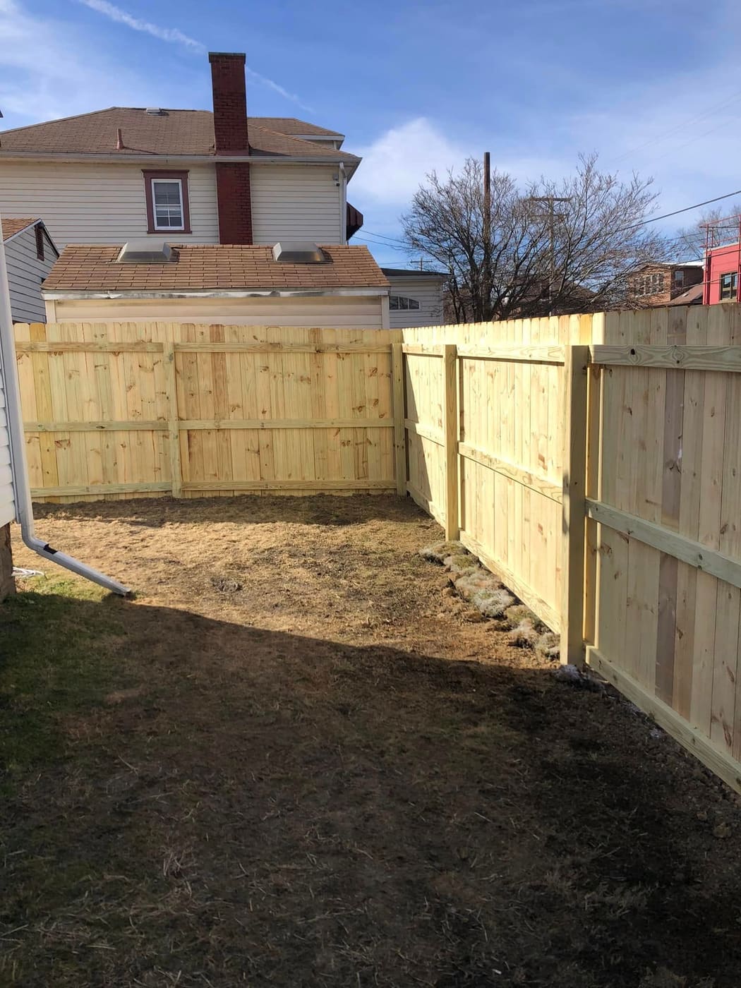 Wood privacy fence around a backyard, view 4