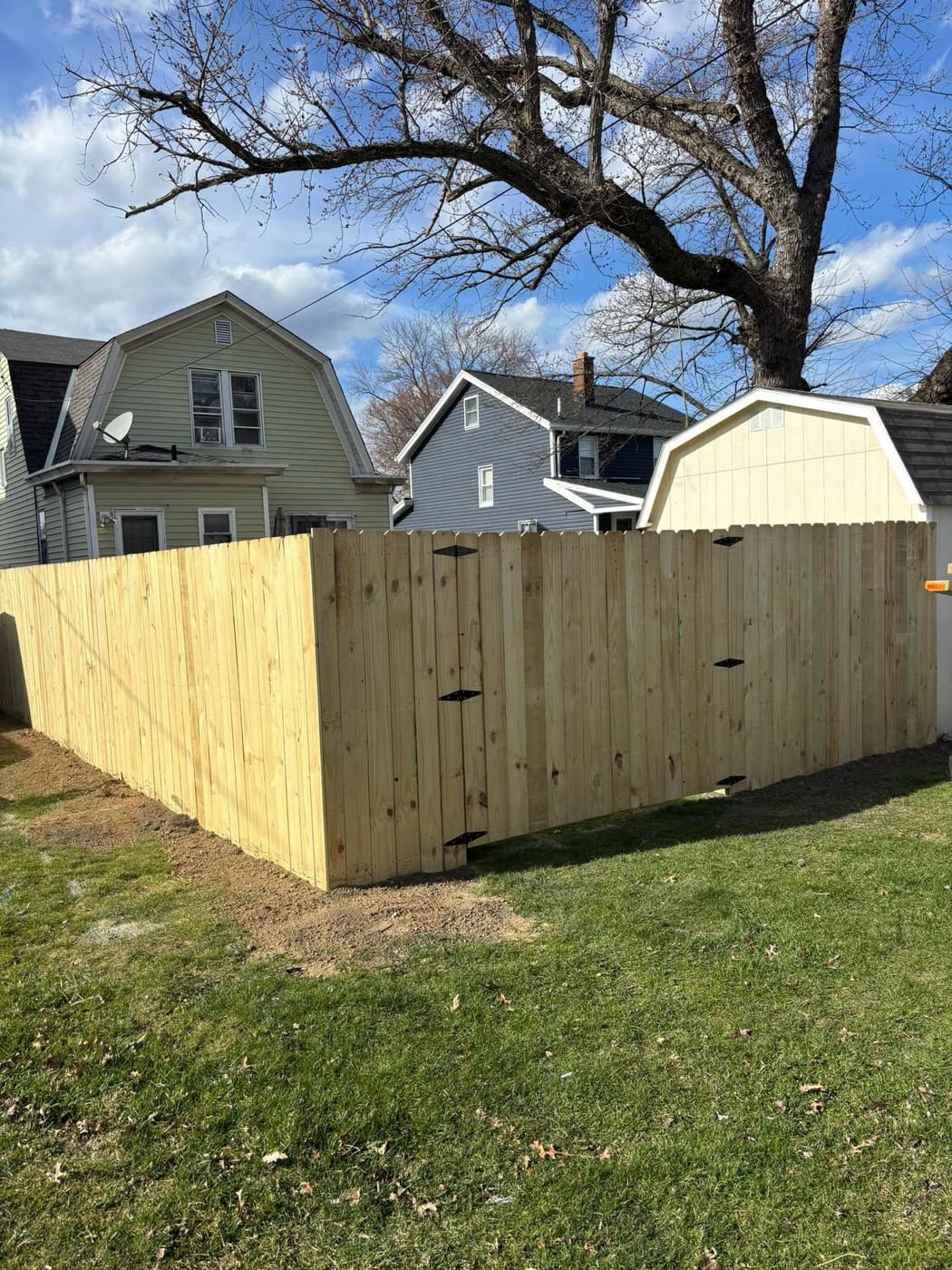 New wood privacy fence around a backyard