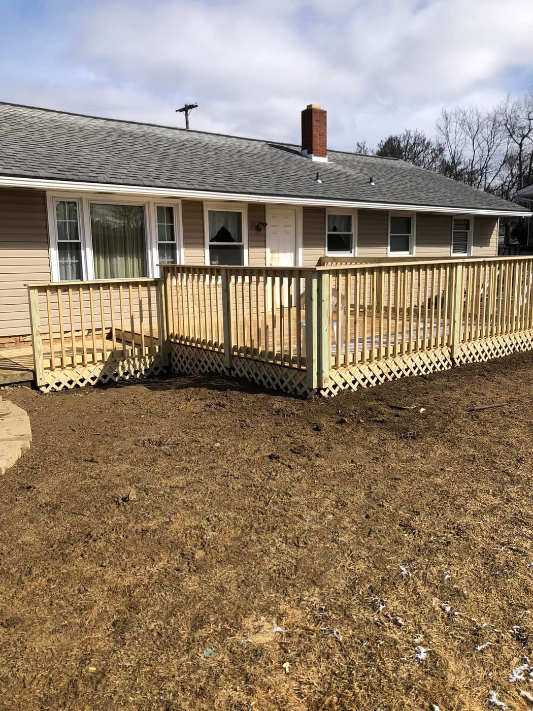 Deck along the back of a ranch house