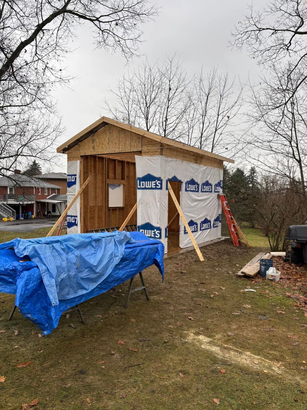 Shed being rebuilt at a new location, view 3