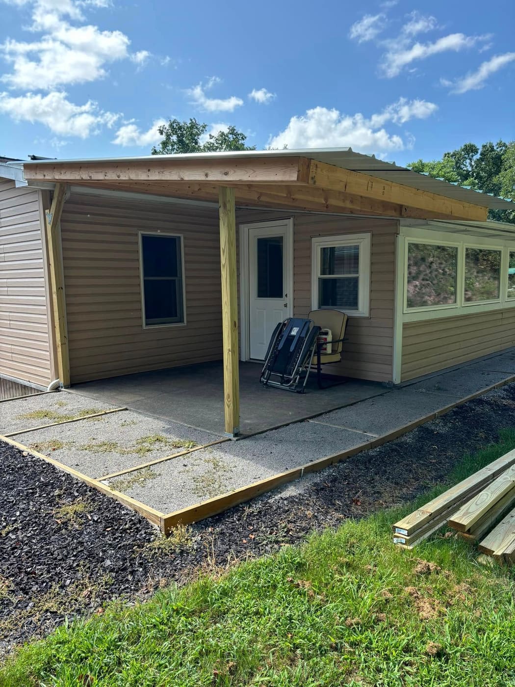 Before: Covered porch enclosed with screens