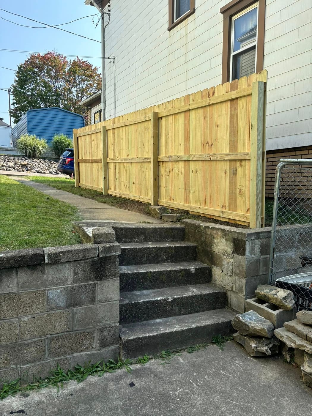 Wood privacy fence along a side yard