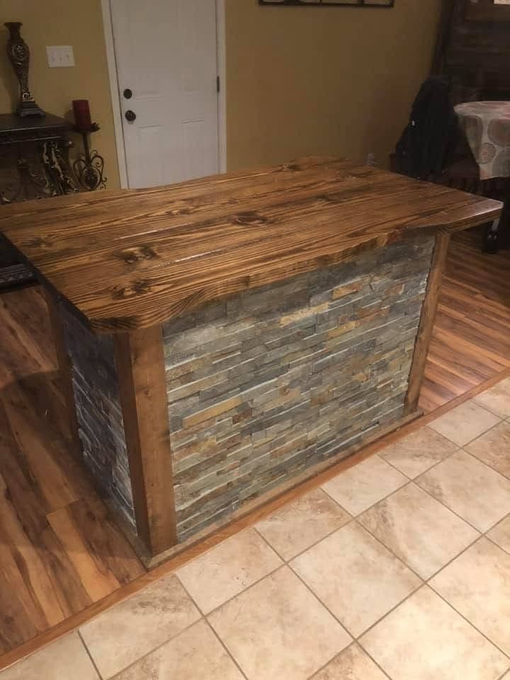 Home bar with stacked-stone front and wood top