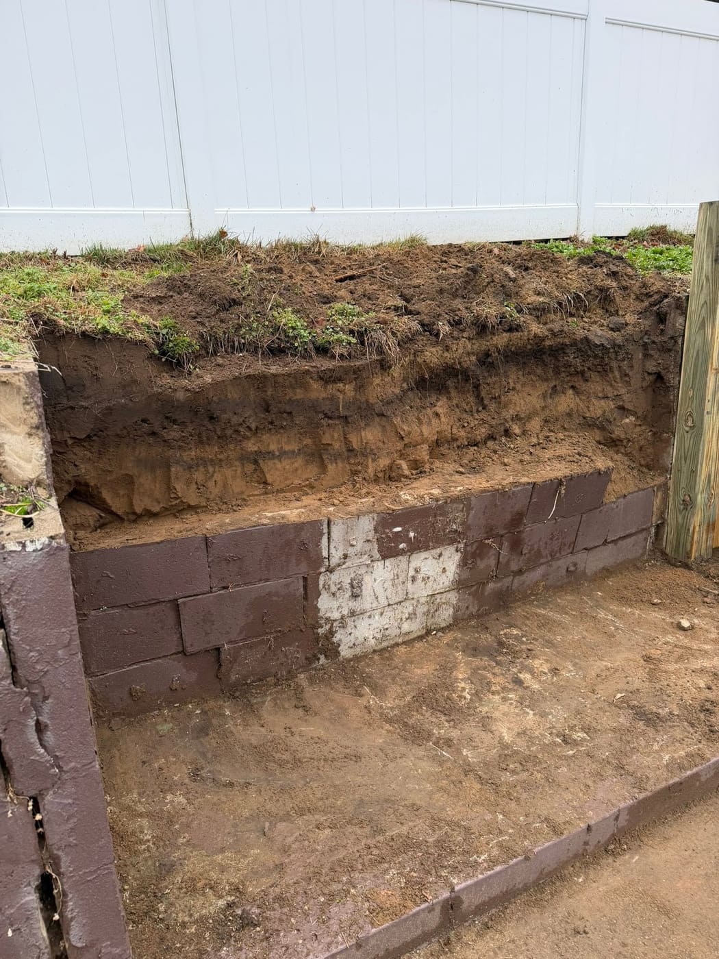 Before: New timber retaining wall and stairs behind a house, view 6