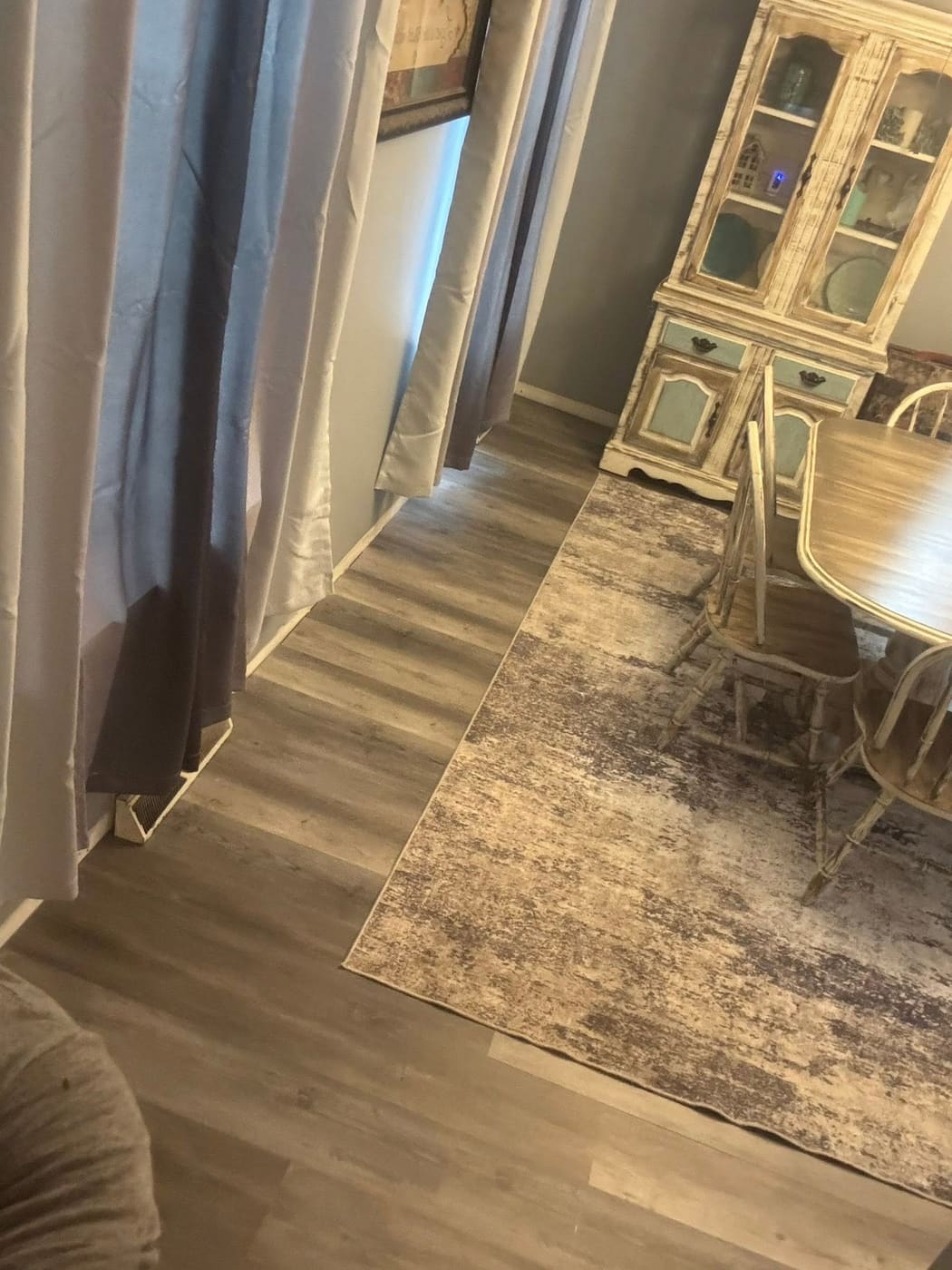 New vinyl plank flooring in a dining room, view 3