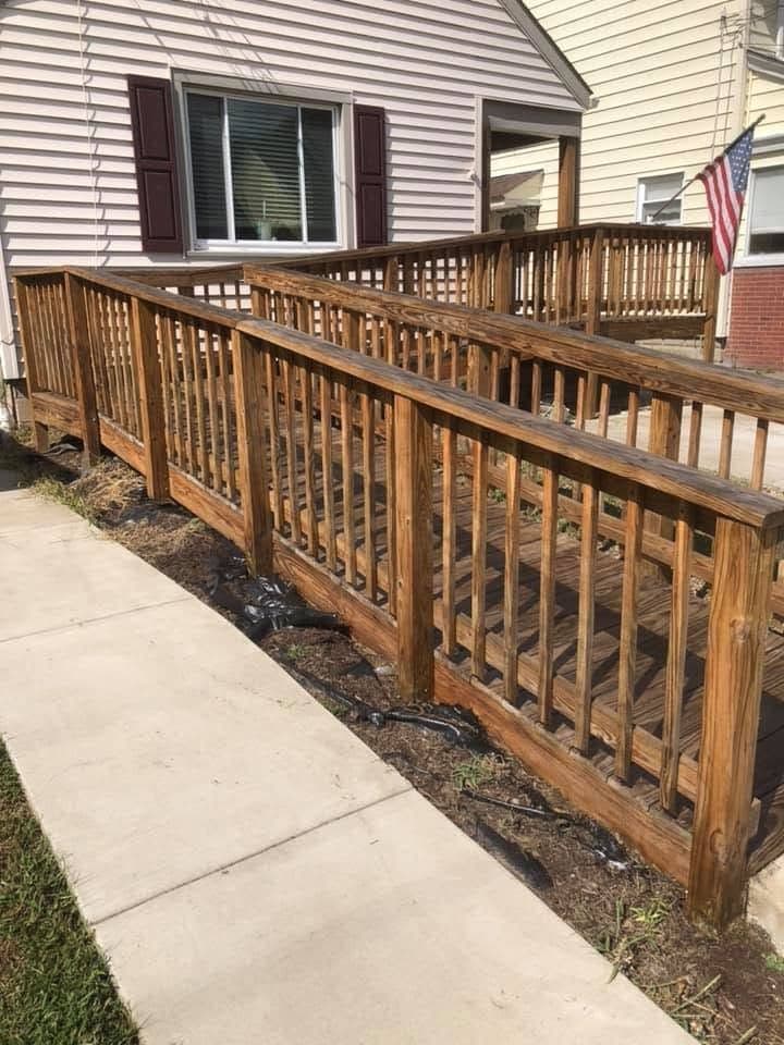 Stained wood railing along a walkway